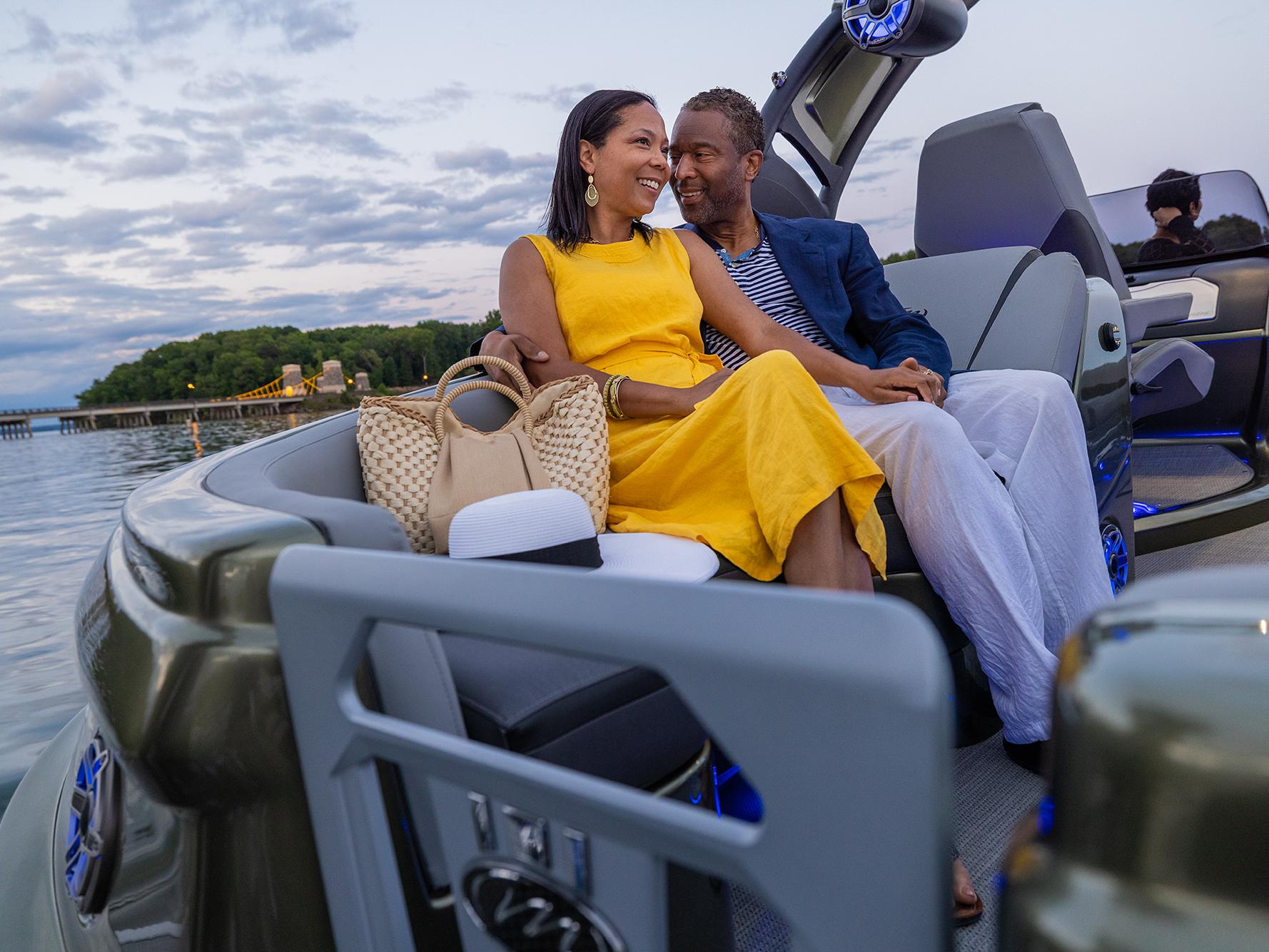 A couple enjoying the comfort of a Manitou XT pontoon boat